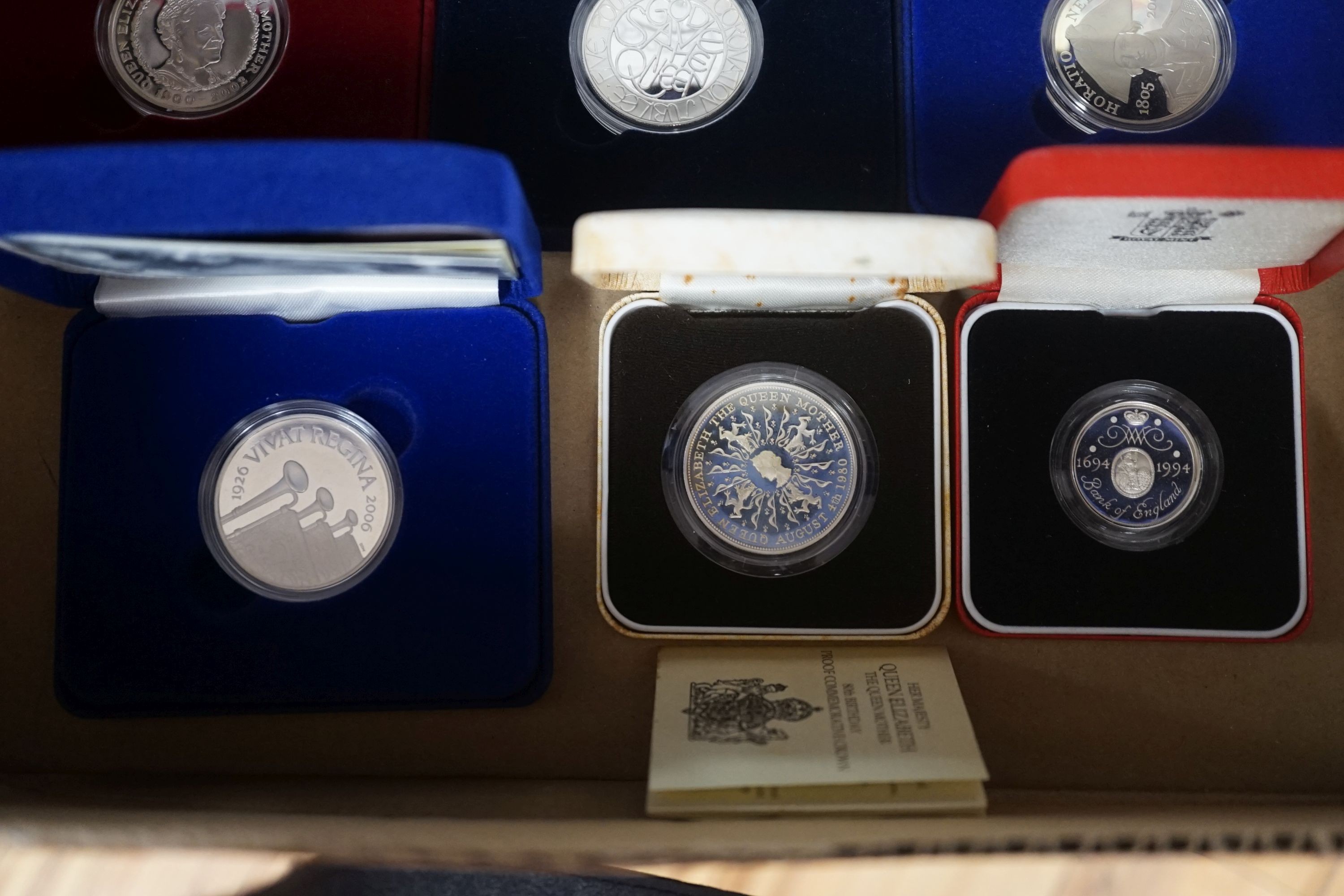 Cased Royal Mint UK silver proof coins – a 2006 1oz. ,Britannia £2, a 2012 QEII Diamond Jubilee £5, 2002 Queen Mother £5, 2003, 2005 and 2006 crowns, a 1980 Queen Mother crown and two piedfort £2 for 1994 and 2004 FIND L